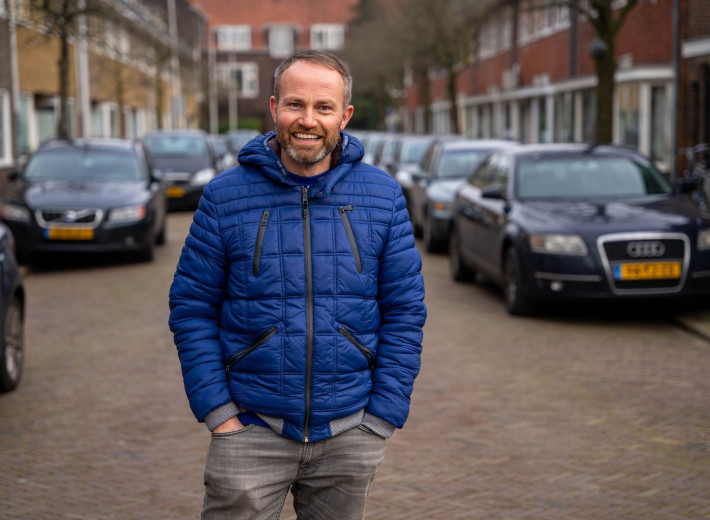 Guy with blue jacket on a street