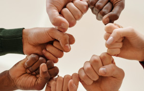 Fists of people with different skin tone